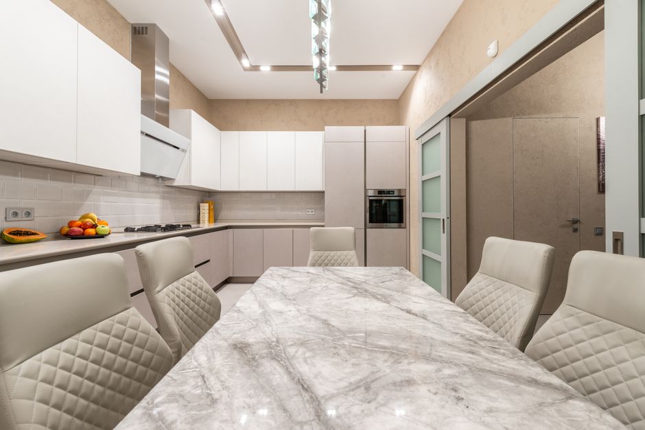 Modern luxury kitchen interior with pristine cabinetry and wide countertops